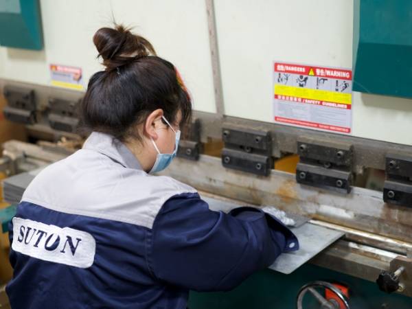 A picture of workers are processing products.