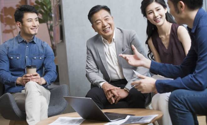 Staff and customers are communicating pleasantly.